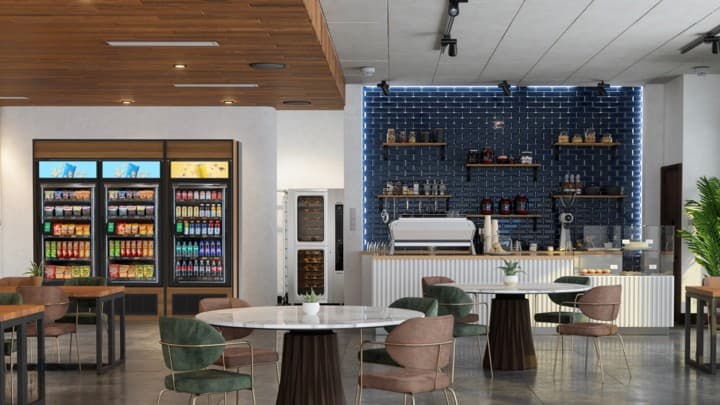 Glass-door coolers in an upscale cafe with blue tile accent wall